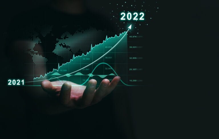 ruka a na ni je rostouci graf pro rok 2022