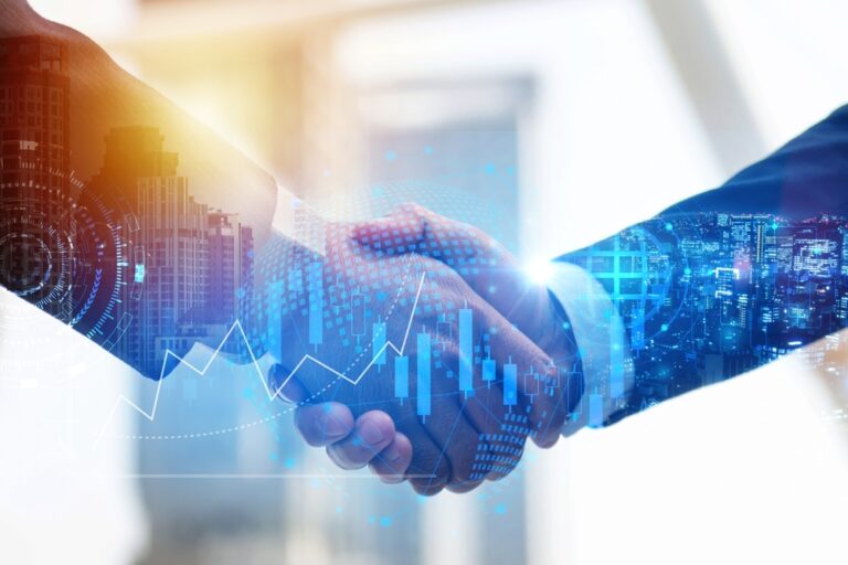 Dva investoři si podávají ruce jako koncept důvěry